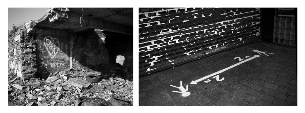 Two photographs in black and white next to one another with a white border around them. The photograph on the left shows a building half demolished. In the middle of the brick wall of the partly demolished building is some spray painted graffiti with a love heart around two initials. The photograph on the right shows a shutter of a shop unit full closed. In front of the shop unit is a sign spray painted on the floor indicating that people must maintain social distancing of staying two metres apart.