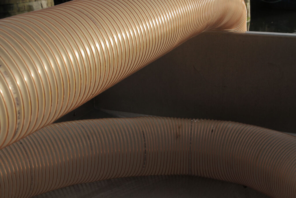 A colour close up photograph of some plastic tubes.