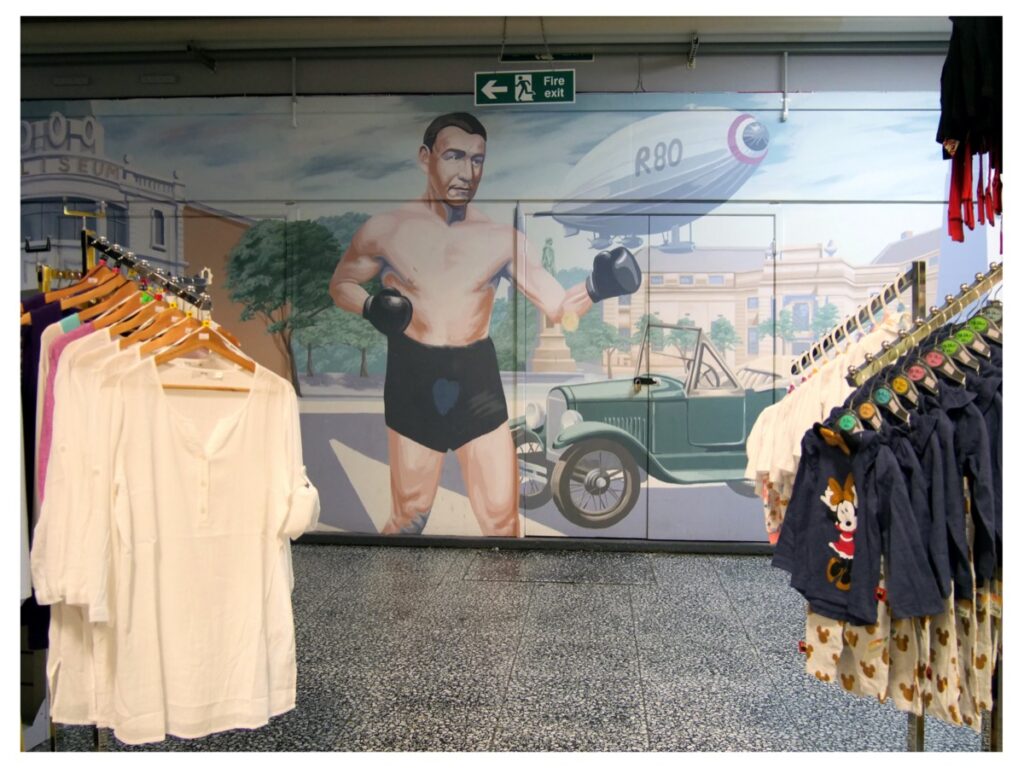 Photograph of painted mural of a boxer in the indoor market in Barrow-in-Furness